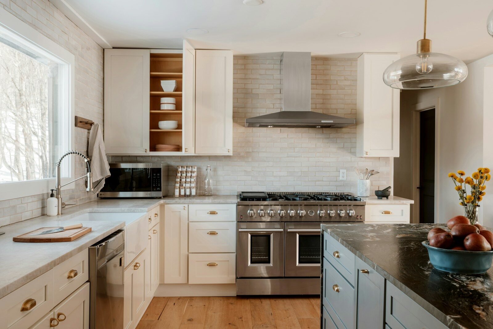 Modern kitchen with stainless steel appliances and white cabinets